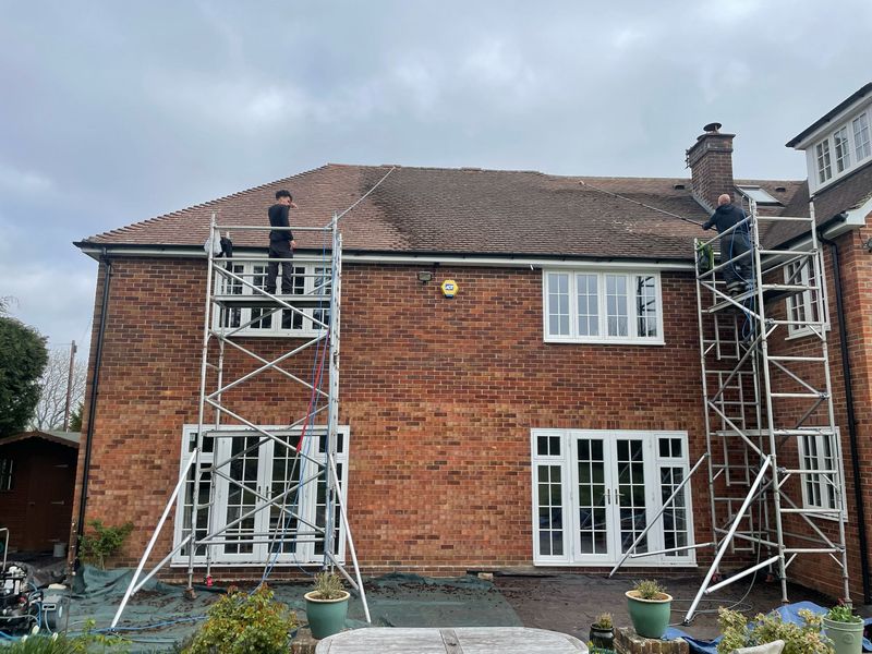 Roof cleaning carried out safely from scaffold towers by The Roof Moss Cleaners in Eastcotts